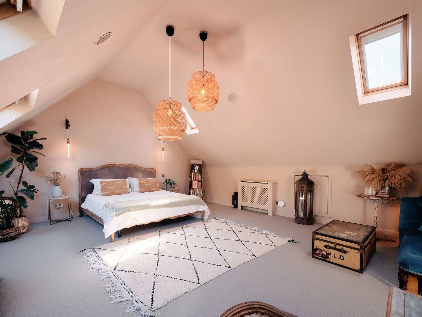 The vaulted master bedroom with skylights