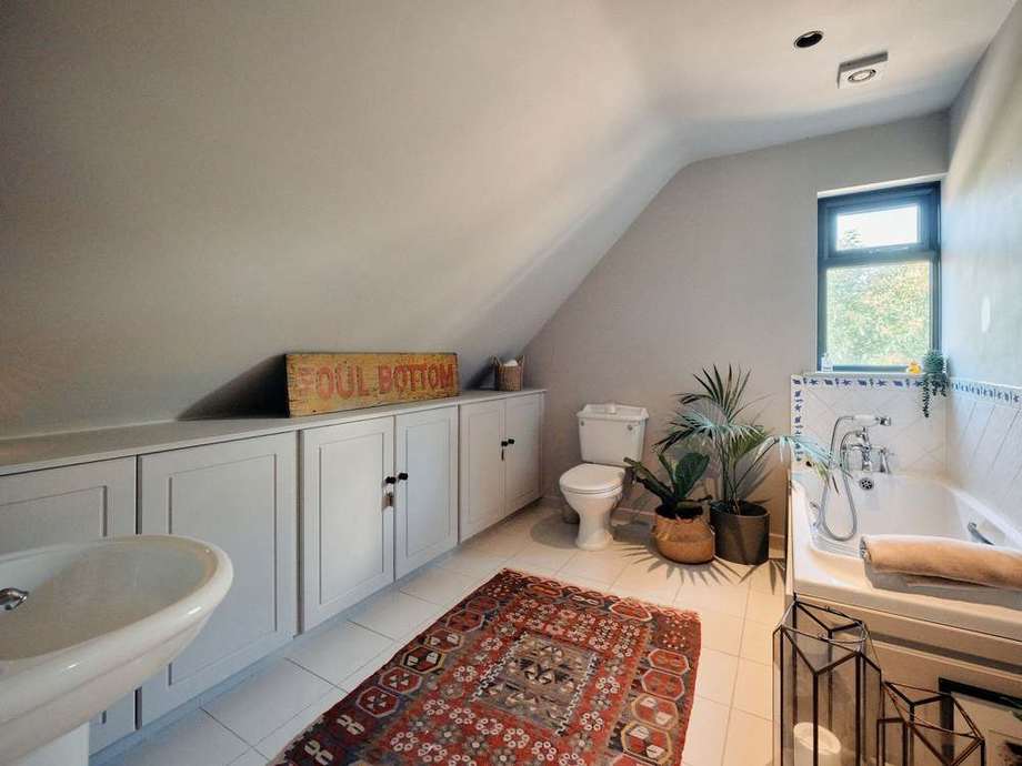 The family bathroom with panelled bath