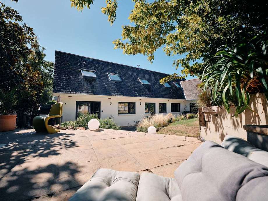 The patio and the back of the house from the garden